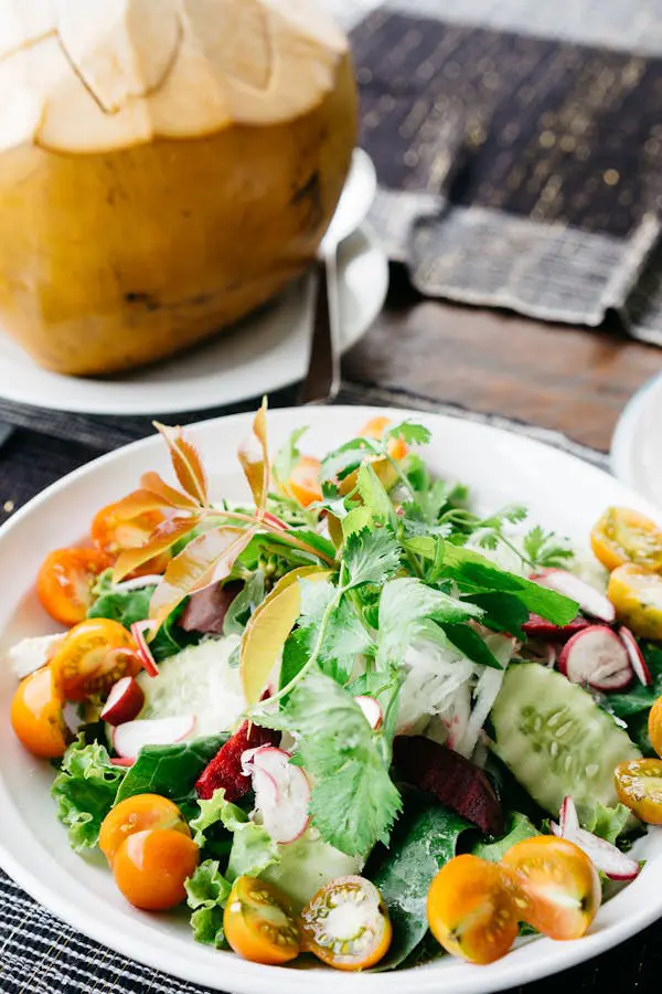 A compost bin filled with kitchen scraps, highlighting the importance of minimizing food waste in sustainable cooking practices.